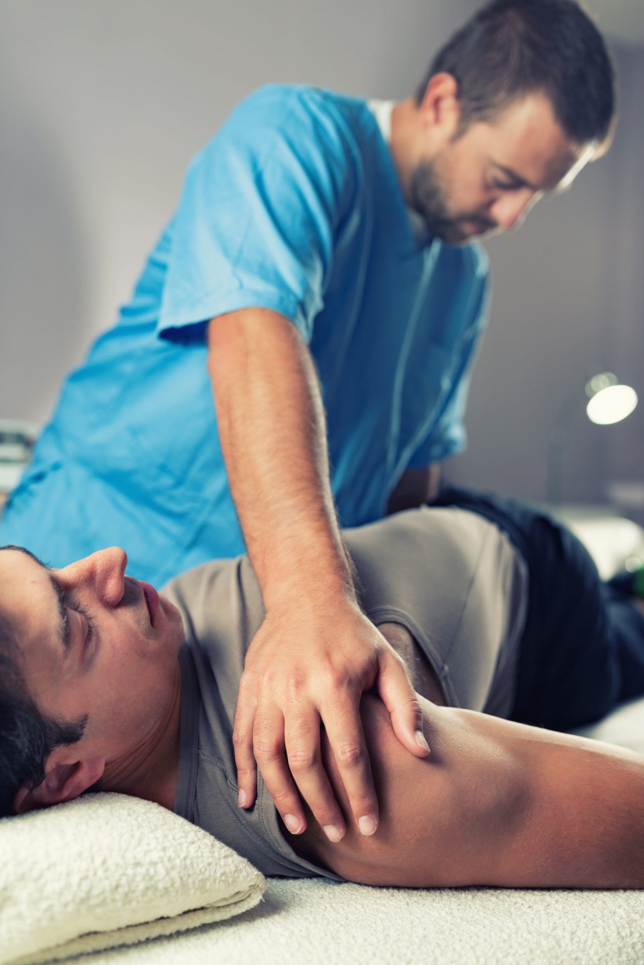 Physiotherapist Working With Patient Back