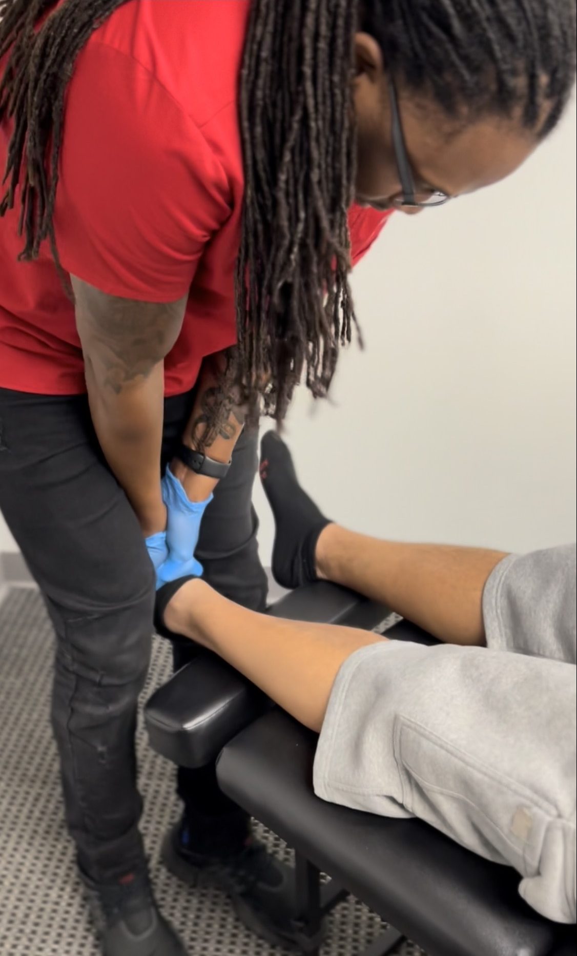 Dr. Bain adjusting patient's ankle