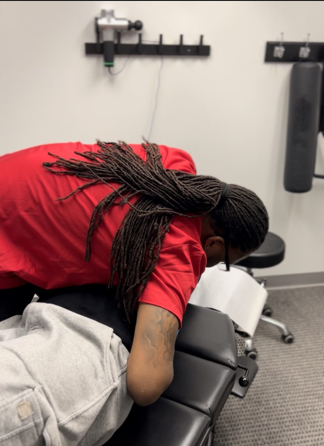 Dr. Bain adjusting patient's middle back